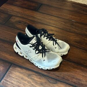 On Running White and Black Athletic Sneakers